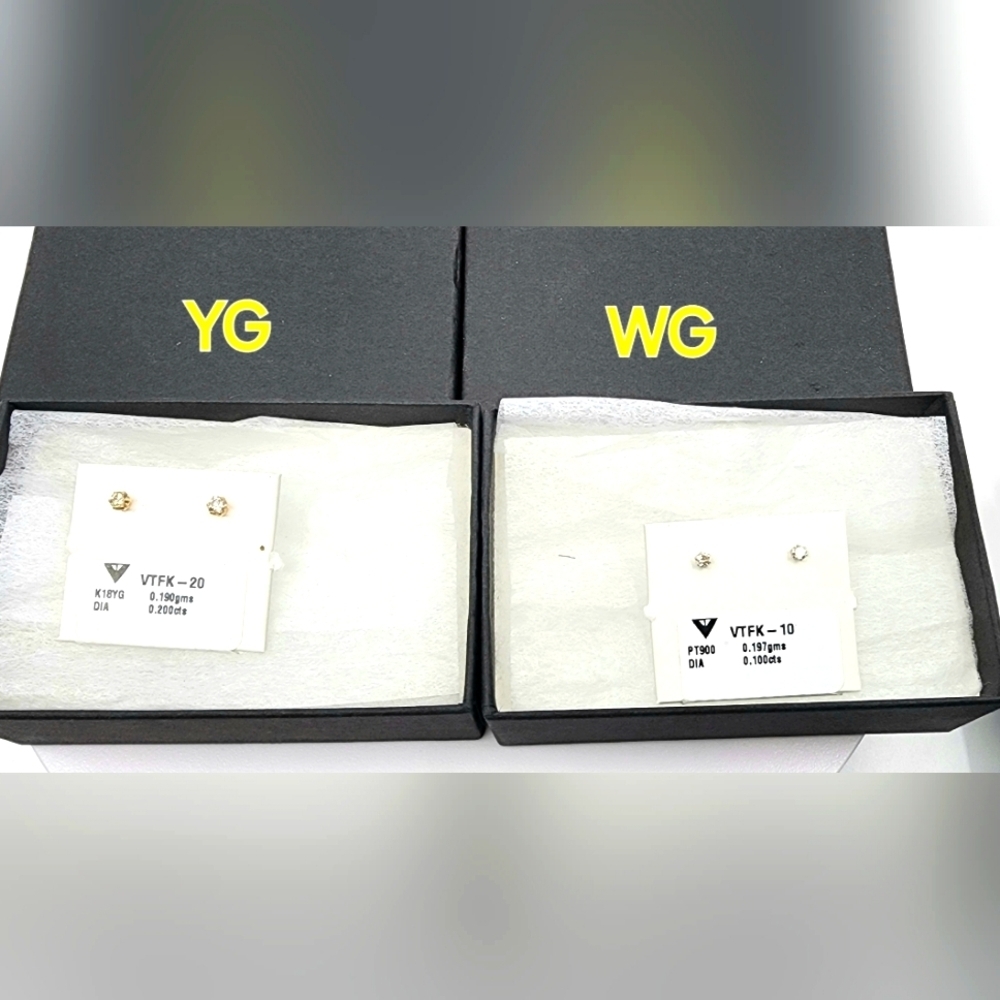 NWOT  .20 Diamond earrings in 18K white gold / Yellow gold